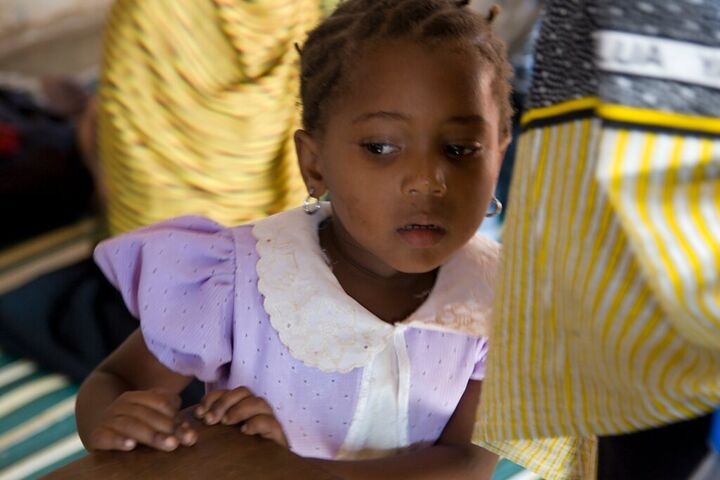 Young girl in a lilac dress