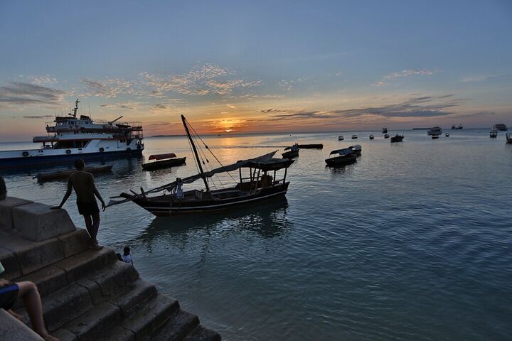 Dhow moored in Stone Town harbour at sunset