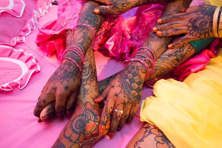 Hands of a bride decorated with henna