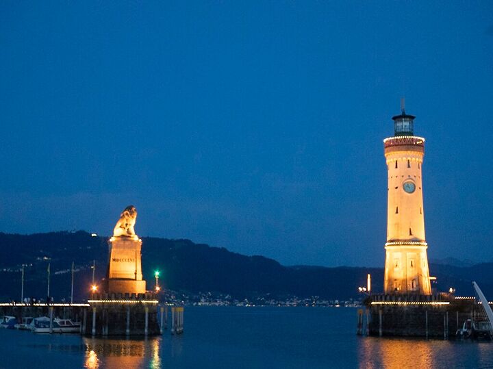 Lindau harbour lighthouse and lion at blue hour