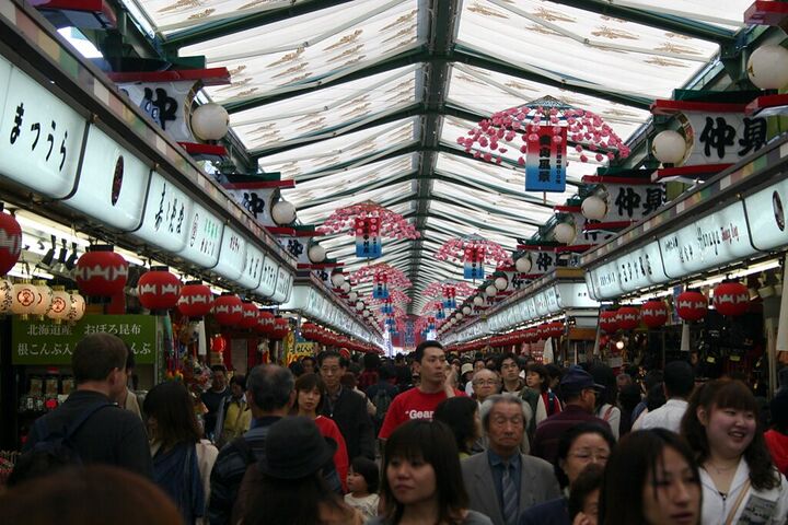 Crowded shopping arcade decorated for a festival